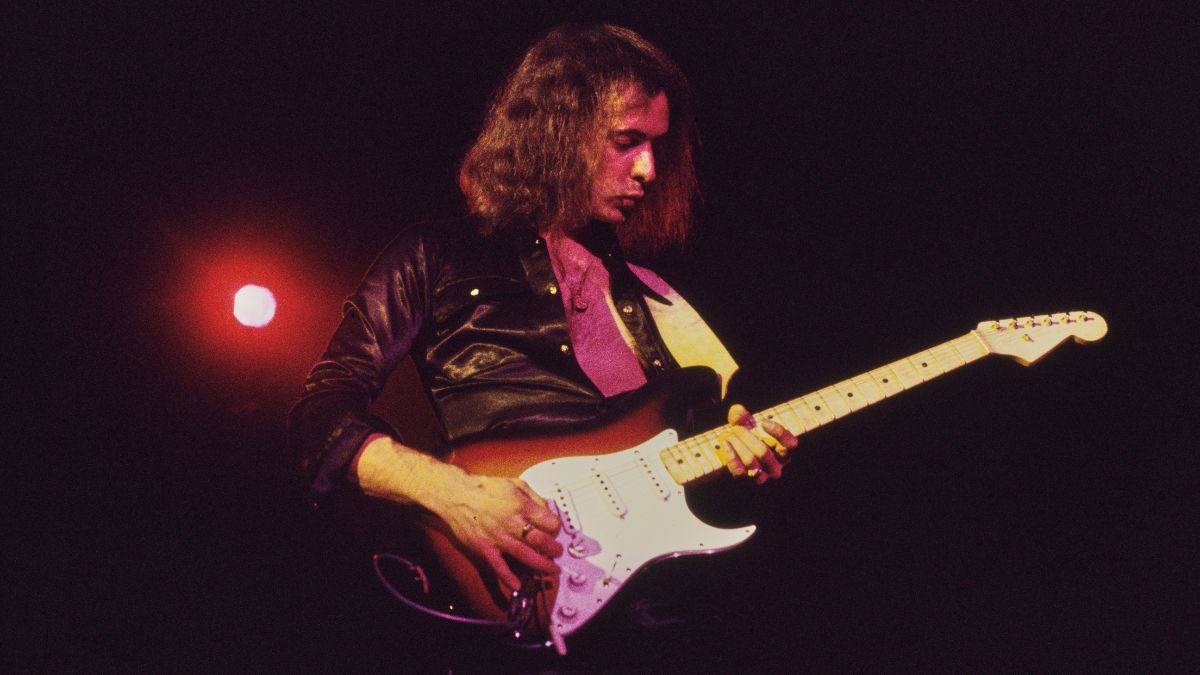 British guitarist and songwriter Ritchie Blackmore, wearing a black shirt, playing a Fender Stratocaster in sunburst, as his band, British rock band Deep Purple, performs live, 1972