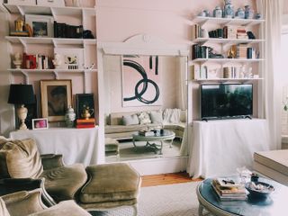 An apartment living room with a large mirror