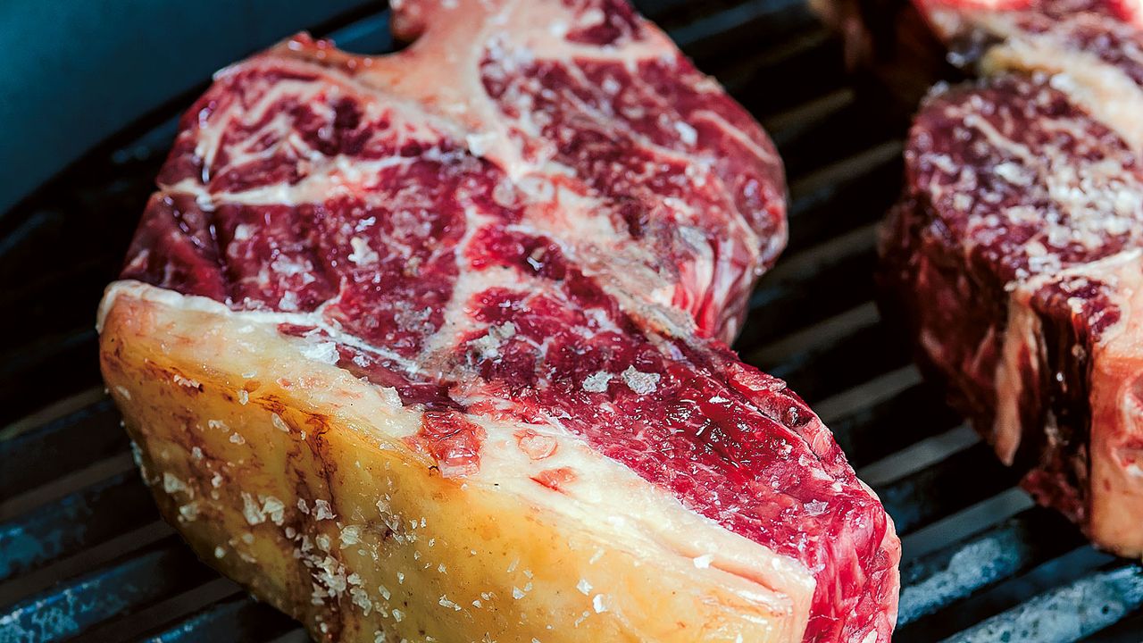 Steak cooking on a barbecue