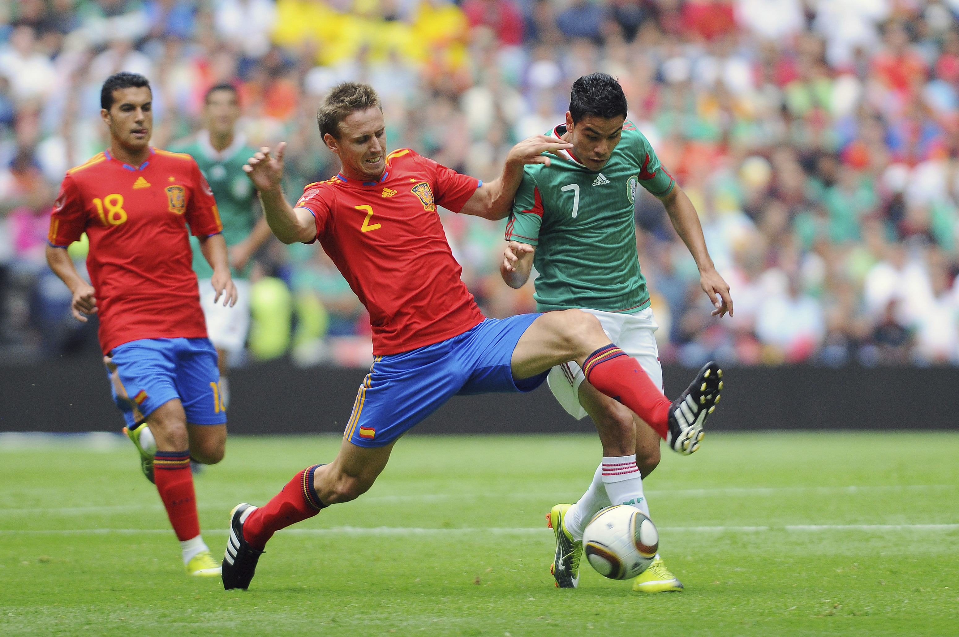 Spain's Nacho Monreal competes for the ball with Mexico's Hector Moreno in a friendly in August 2010.