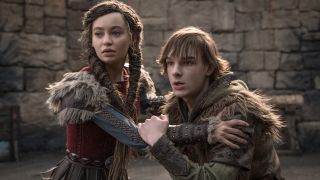 From left to right Astrid (Nico Parker) grasping Hiccup (Mason Thames) by his shoulders in the live-action How to Train Your Dragon. 