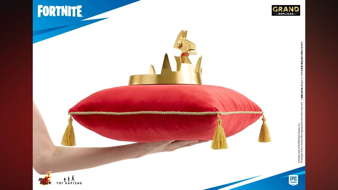 Image of someone holding up the Fortnite Grand Replicas Victory Crown 1:1 Scale Replica on its pillow.