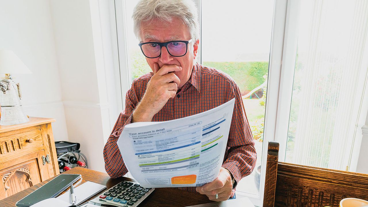 Man looking at an energy bill 