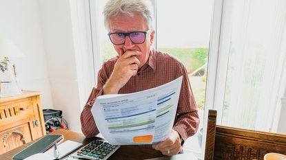 Man looking at an energy bill 