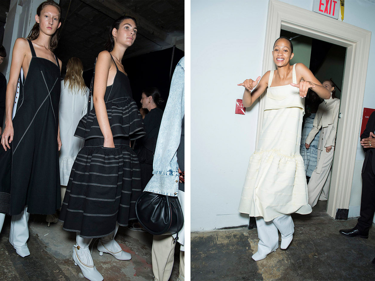 Models wear ruffled black and white dresses with white trouser and leather boots