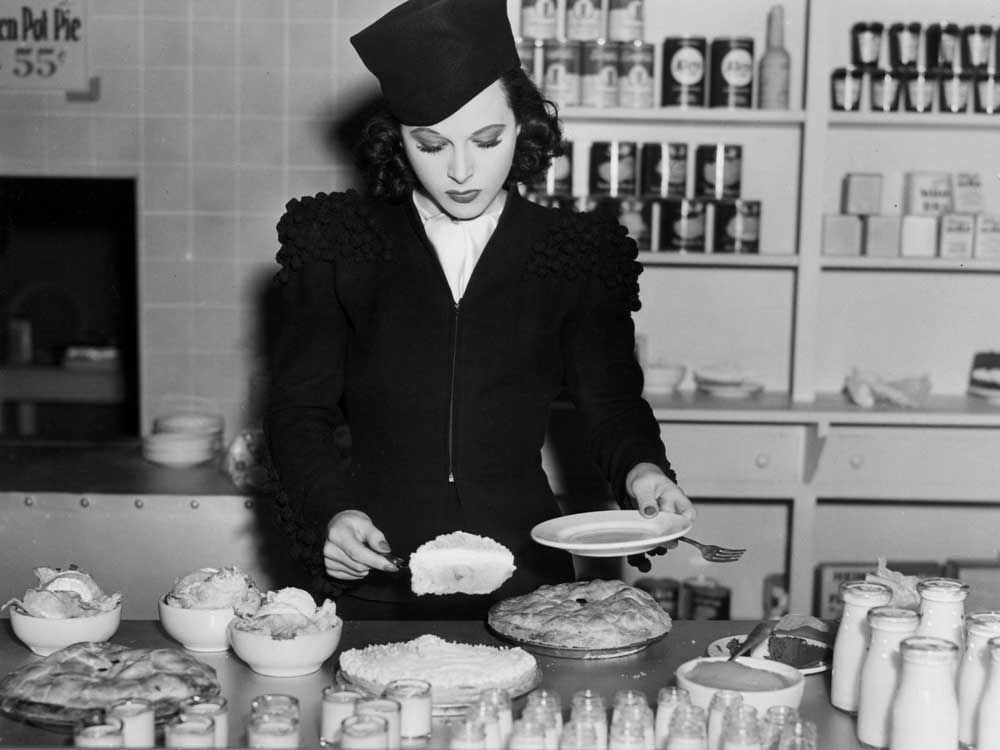 Photo of a vintage model eating cake