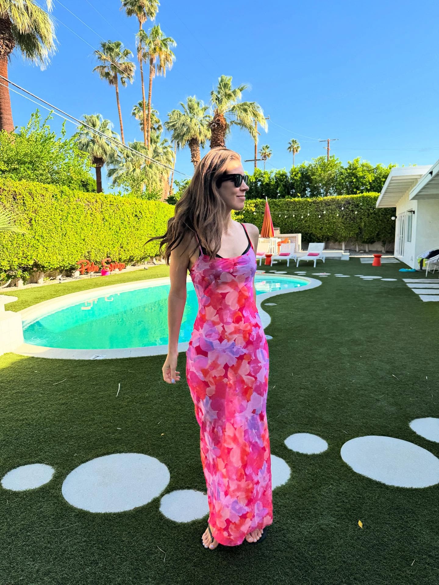 Woman in sheer pink floral dress