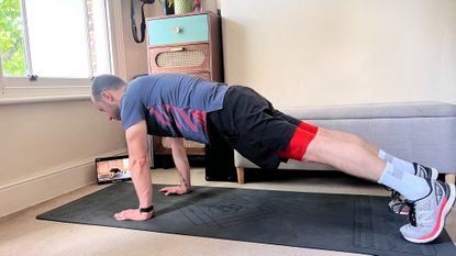 James Frew holding plank position during a Centr workout