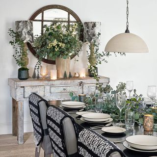 White dining room with festive foliage