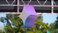 The Gemini logo orb hanging from a booth at I/O 2025.