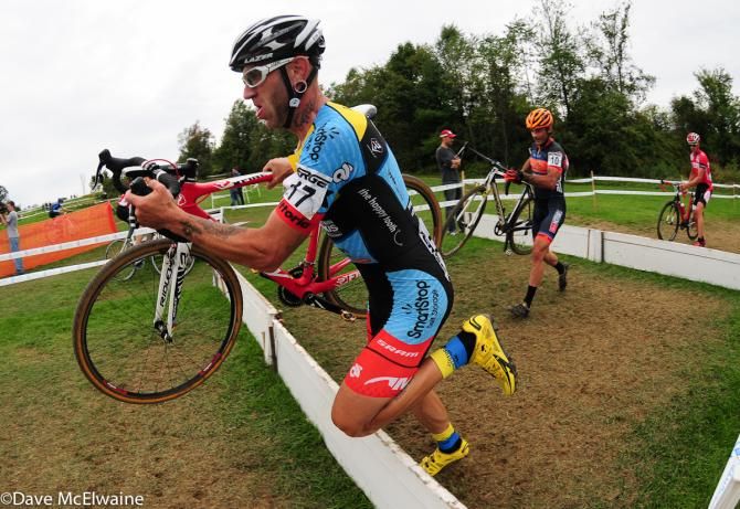 Adam Myerson (Smartstop/ Mountain Khakis) running the barriers early in the race