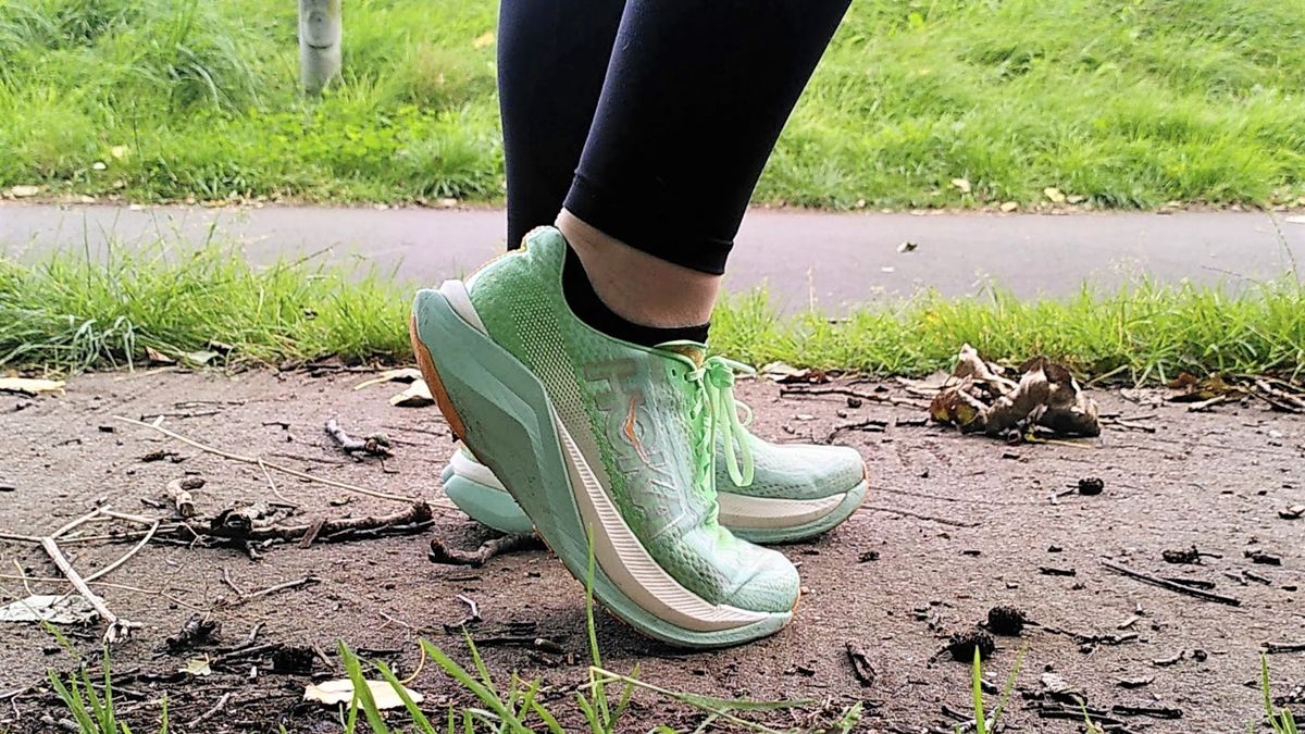 Woman&#039;s feet wearing Hoka Mach X running shoes