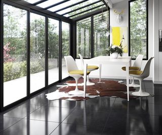 black glossy floor tiles in black lean to conservatory
