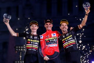 American cyclist Sepp Kuss with his Jumbo-Visma teammates after he won the 2023 Vuelta a Espana