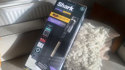 Shark Stratos Cordless [IZ420UKT] vacuum in box on sofa