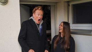 Conan O'Brien looking shocked and a fan on Conan O'Brien Must Go