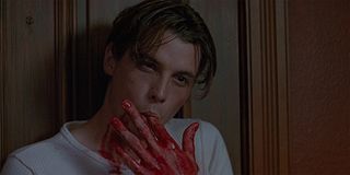 Billy licking fake blood off fingers in Scream