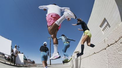 Nike Invincible 3 review: Pictured here, a group of runners jumping off from a ledge 