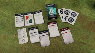 Pariah Nexus Mission Deck box and cards laid out on a grassy mat