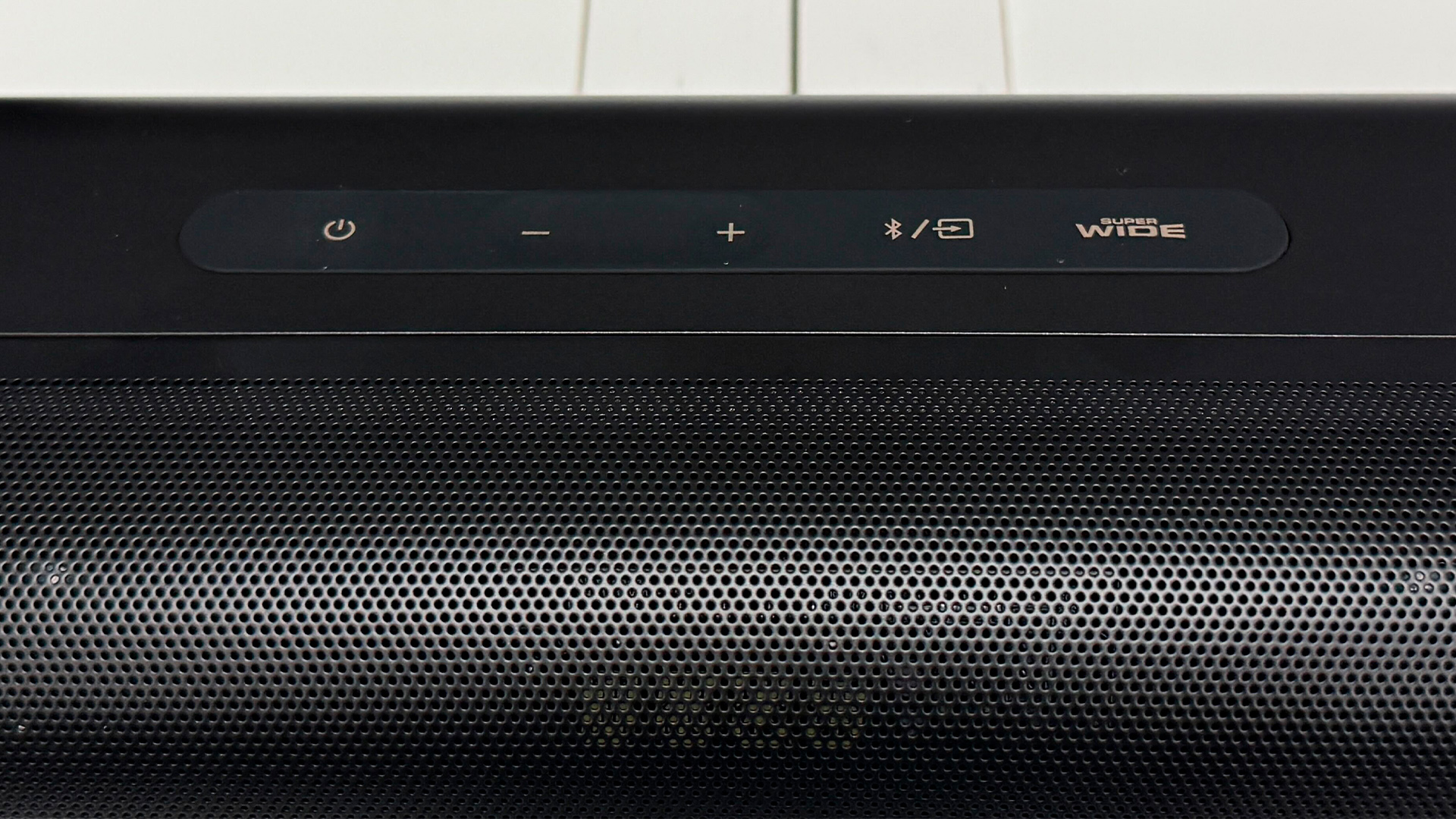 Creative Stage Pro soundbar close up on middle of bar showing grille and controls