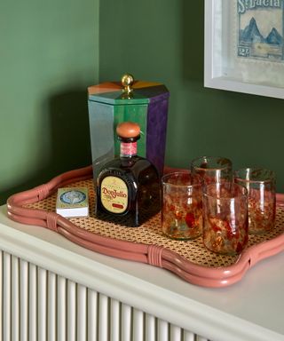 decorative wavy rattan tray with collected home bar items