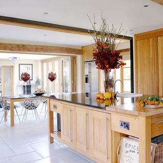 kitchen room with dining table and flower vase