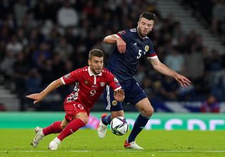 Grant Hanley (right) in action for Scotland