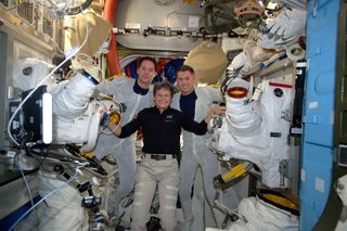 Astronauts Prep Spacesuits for Spacewalk