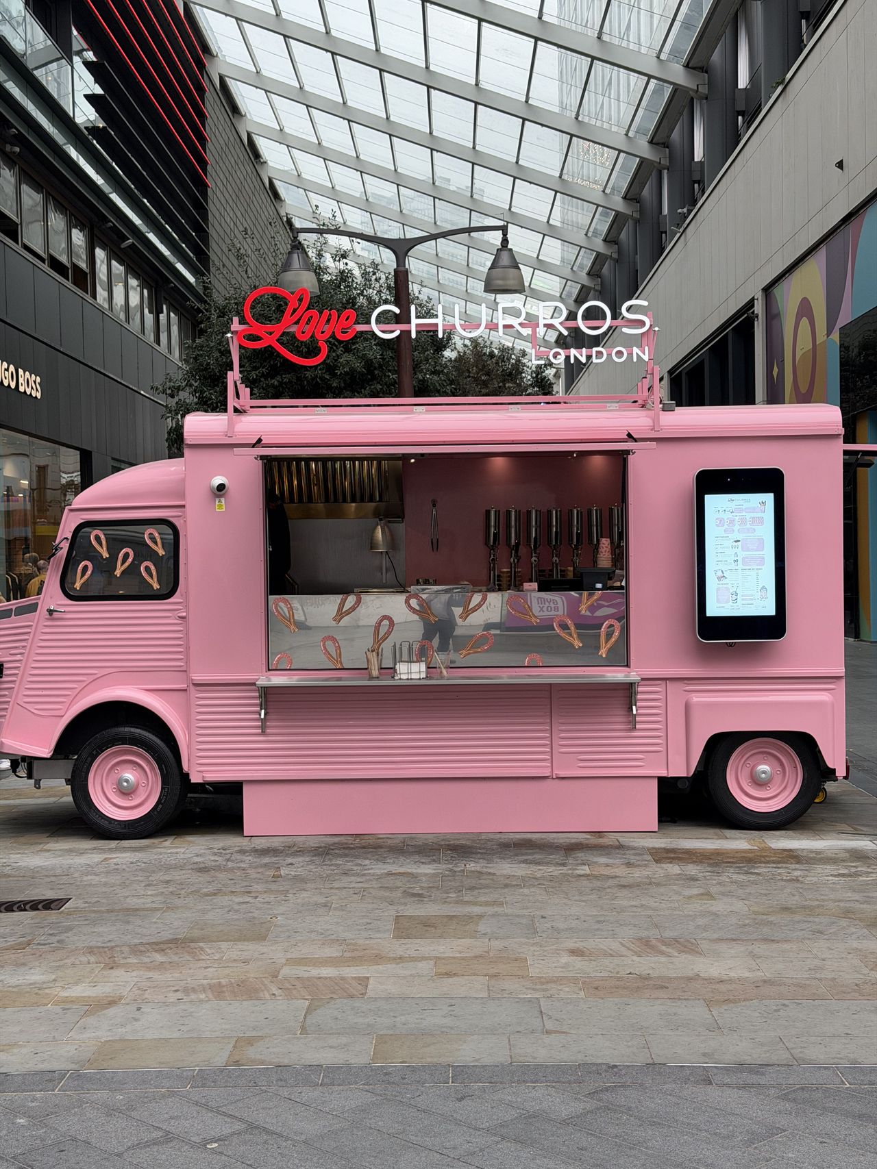 Sample photo from iPhone Pro showing churros van in bright pink
