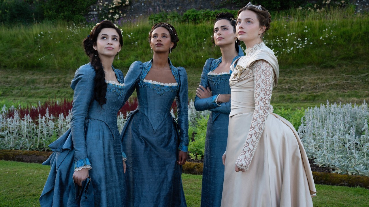 Mabel, Conchita, Lizzy and Nan in dresses looking up in The Buccaneers Season 2