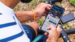 Man using TrainingPeaks app on smartphone