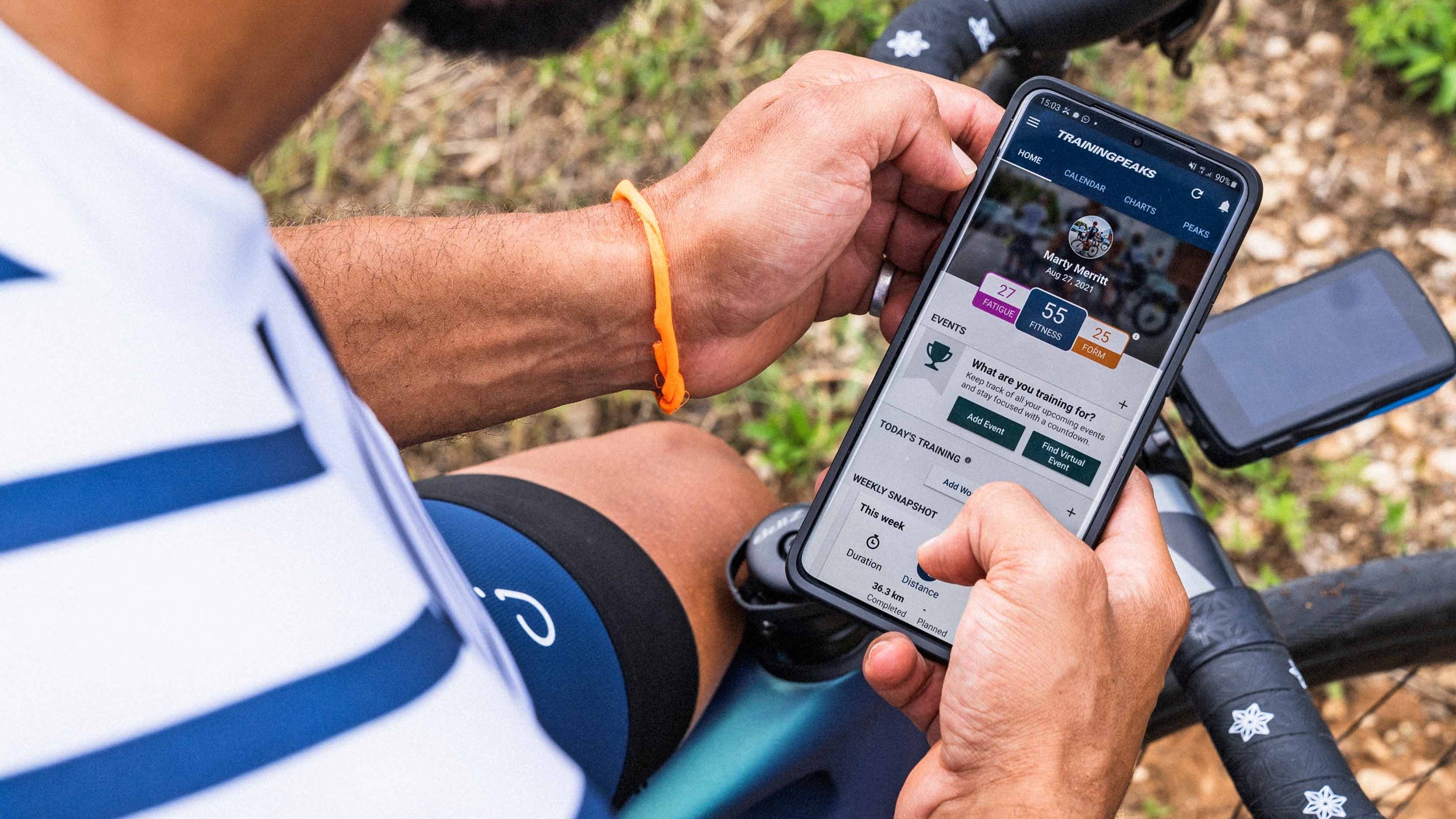 Man using TrainingPeaks app on smartphone