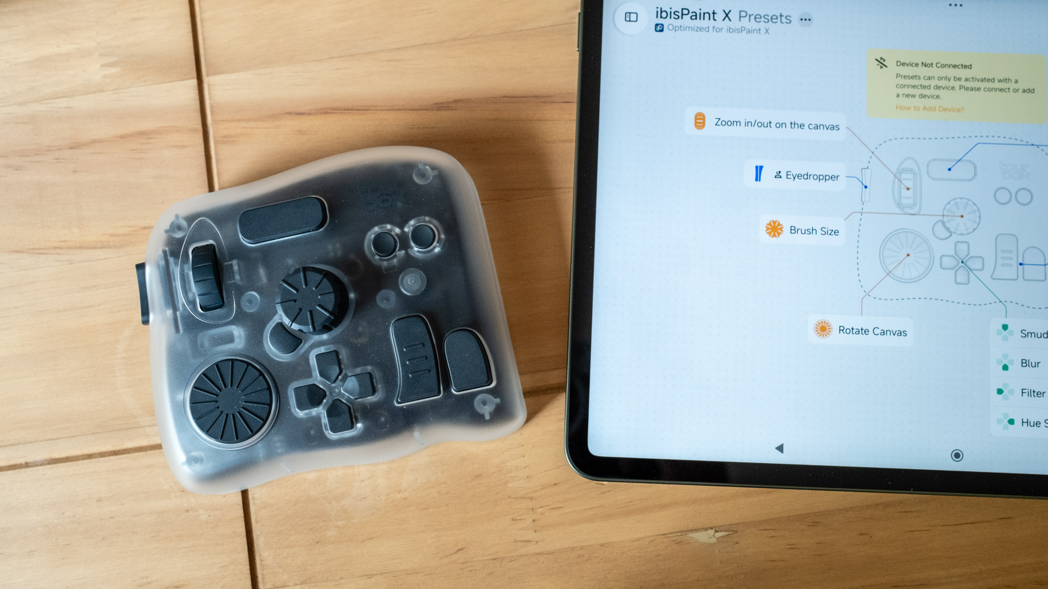 Tourbox Elite Plus next to an Android tablet