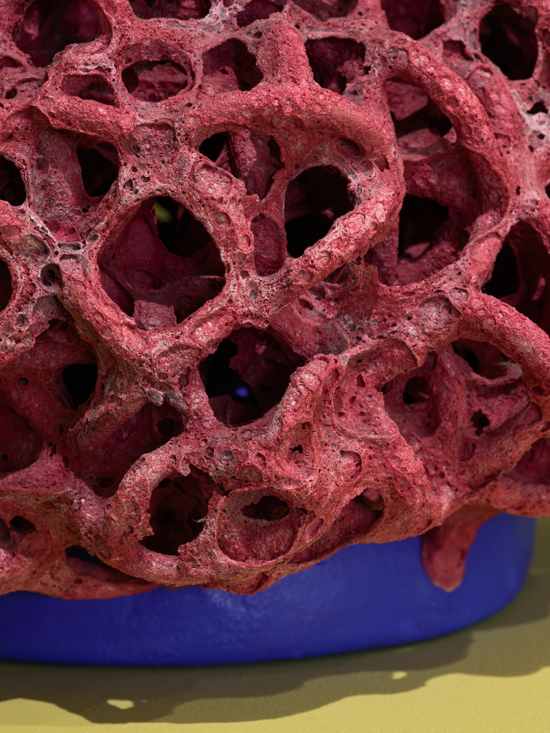 Futuristic ceramics in green gallery space