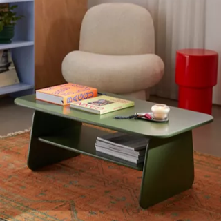 green coffee table with rounded edges and shelf