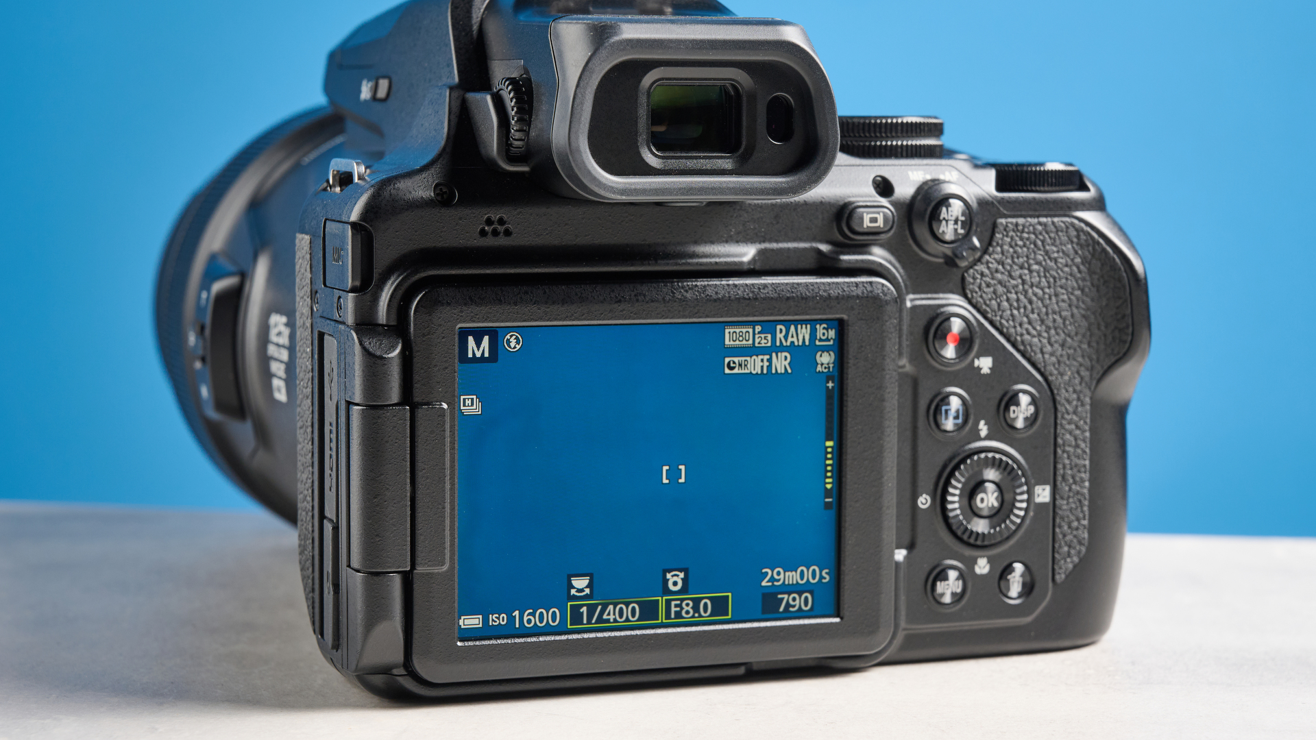 A black Nikon Coolpix P1100 digital camera