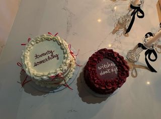 A closeup of Kendall Jenner's birthday cakes, which read "twenty something" and "witches don't age."