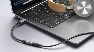 The UGreen USB-C to 3.5mm jack plugged into a laptop