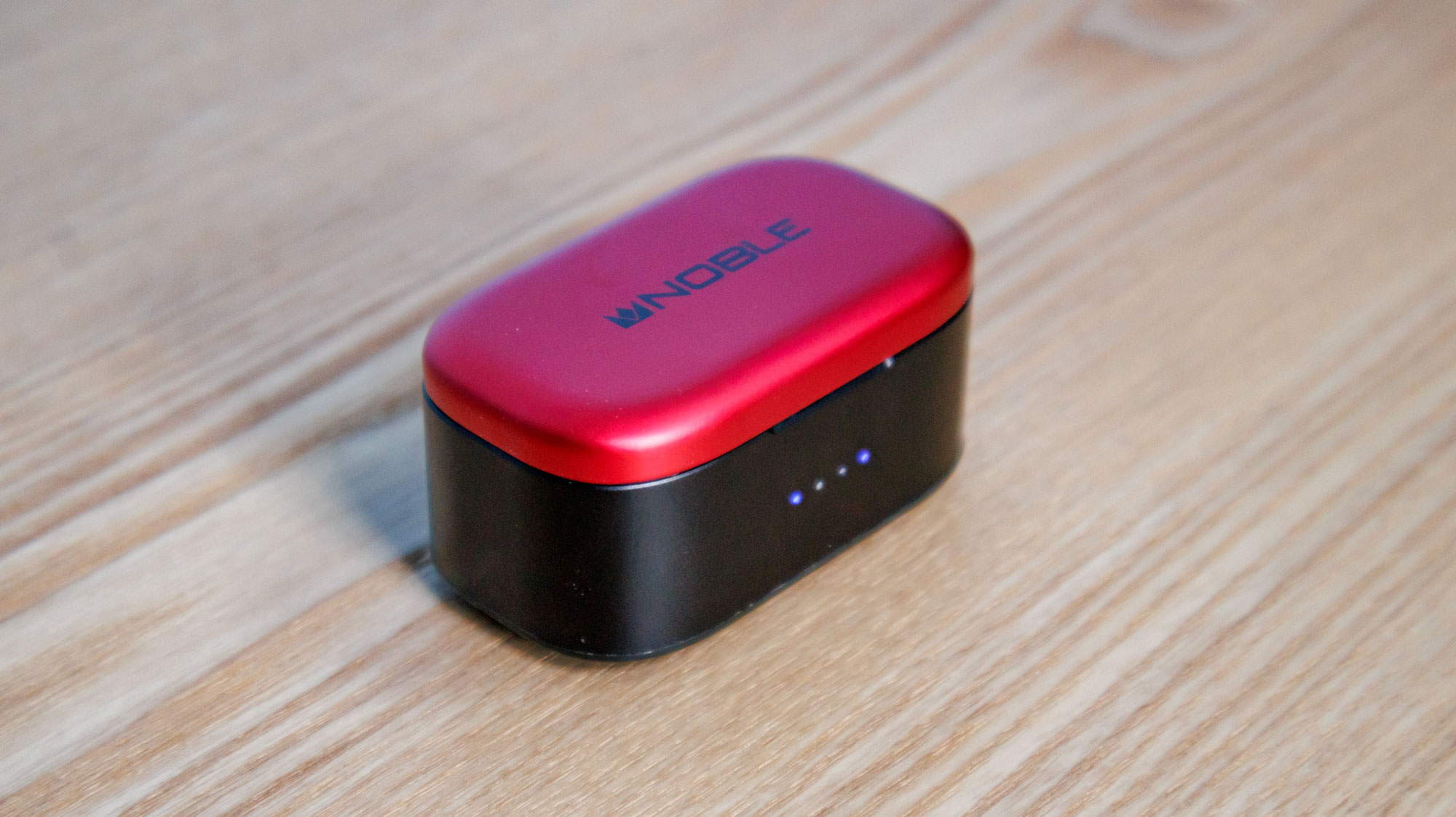 Noble Fokus Amadeus on a wooden surface, another angle of the case