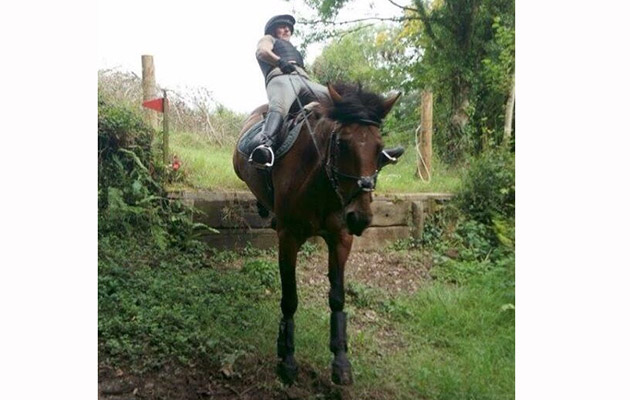 This is me taking Quincy cross-country schooling. We came into this small step rather slowly. Quincy was a bit nervous of it but with a bit of encouragement she gave it a go and leapt down. I flew backwards but luckily she just stopped straight after, bless her, so I managed to stay on&rdquo; &mdash; Emily Diamond