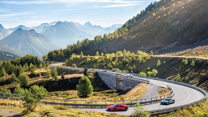 Fast cars on a mountain road