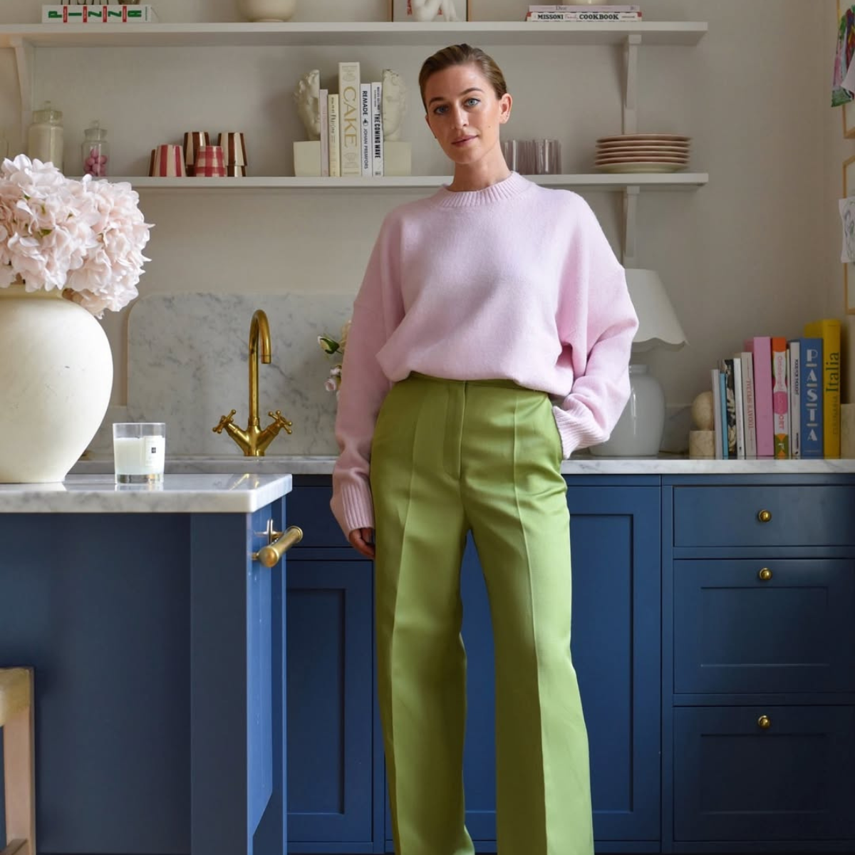 @emvonhofsten wears purple jumper green trousers