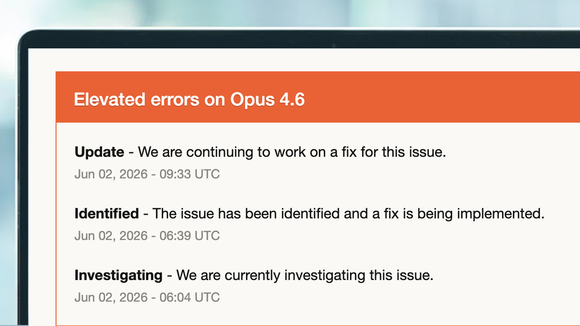 A laptop screen showing 'elevated errors' on Claude's status page.