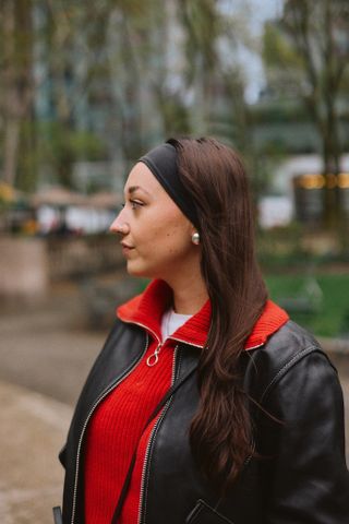 Emma Childs with her hair down in a thick black headband