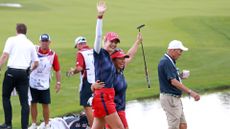 USA golfers Nelly Korda and Megan Khang react to winning the match on the 14th hole during the Friday Four-Ball of the first round of the 2024 Solheim Cup on September 13, 2024, at Robert Trent Jones Golf Club at Gainesville, Virginia.