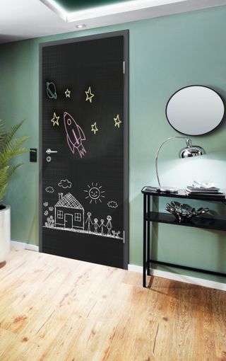 Chalkboard door in a green hallway