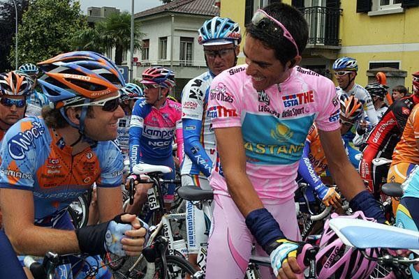 Christian Vande Velde and Contador share a laugh before the start of stage 18.