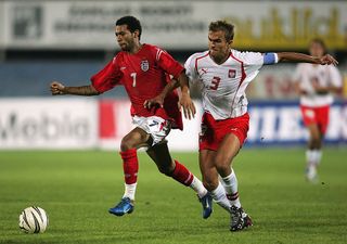 Jermaine Pennant of England battles with Antoni Lukasiewicz of Poland during the U21 European Championship Qualifier match between Poland U21 and England U21 at the Mosir Stadium on September 7, 2004 in Rybniku, Poland. (Photo by Shaun Botterill/Getty Images)