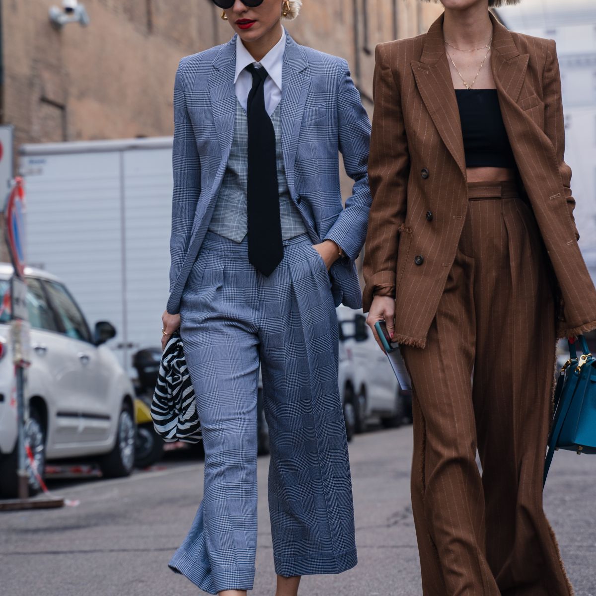 Milan, Italy - 20 February 2020: Stylish persons are posing for photographers before Max Mara fashion show on Milan Woman's Fashion Week F/W2020-2021, street style - stock photo