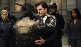 Battlestar Galactica Lee Adama hugs a pilot on deck